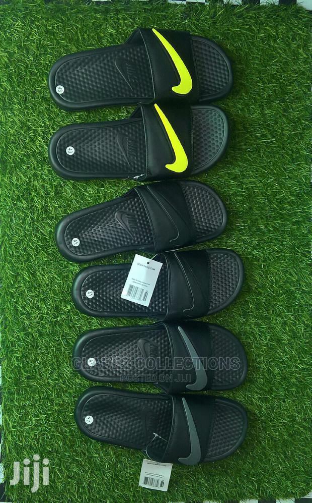 academy nike slippers