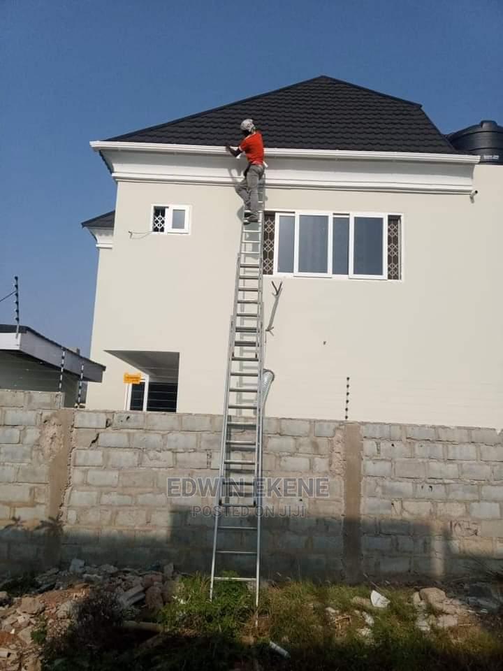 Installing Rain Gutters in Lapaz Building Materials, Edwin Ekene